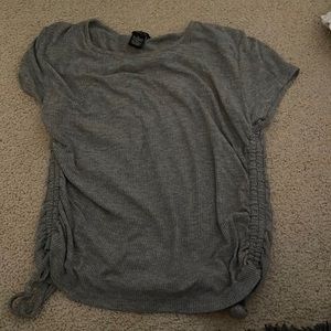 grey t-shirt with ties on side.